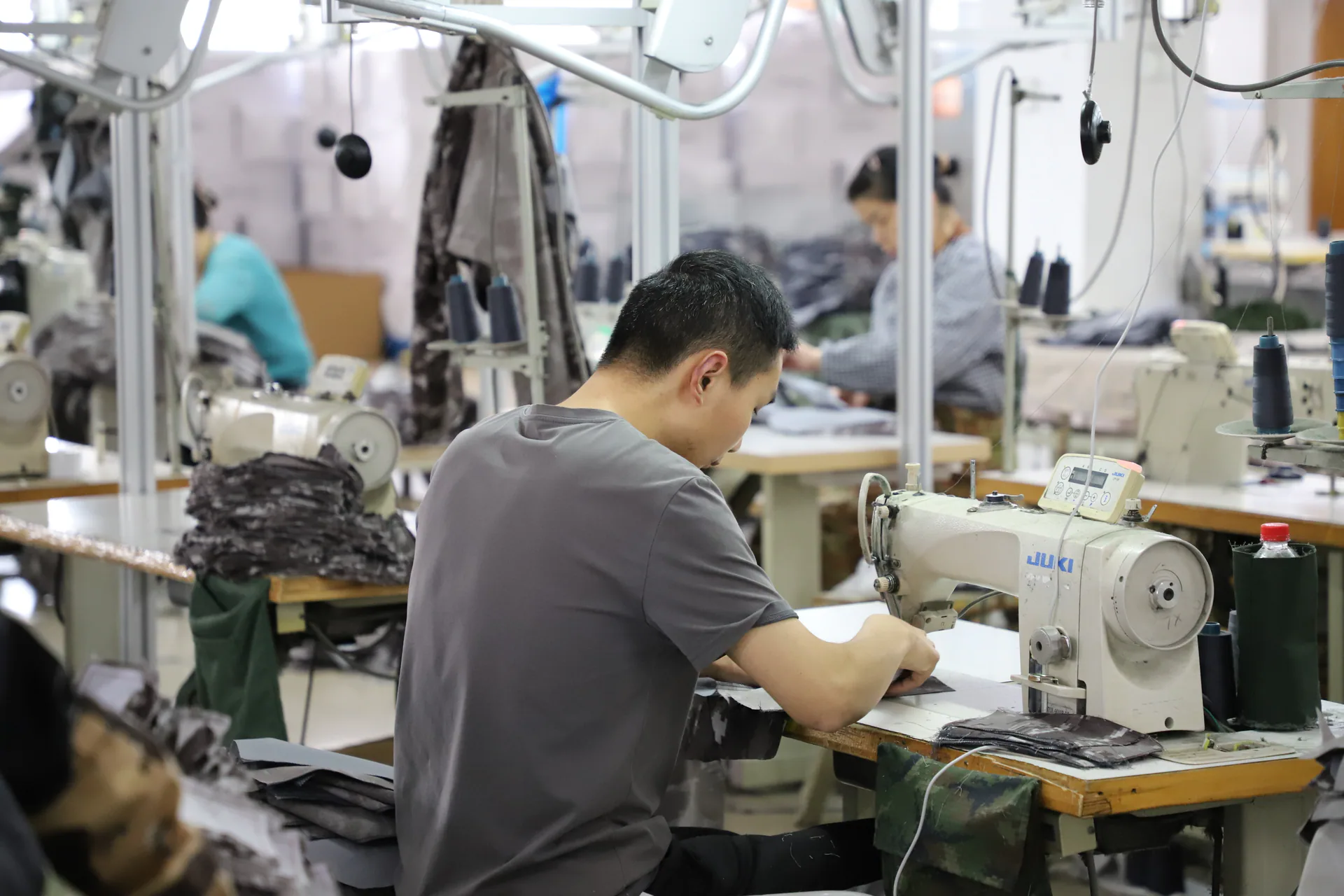 Garment sewing workstation in a Wuhan Jinteng production area