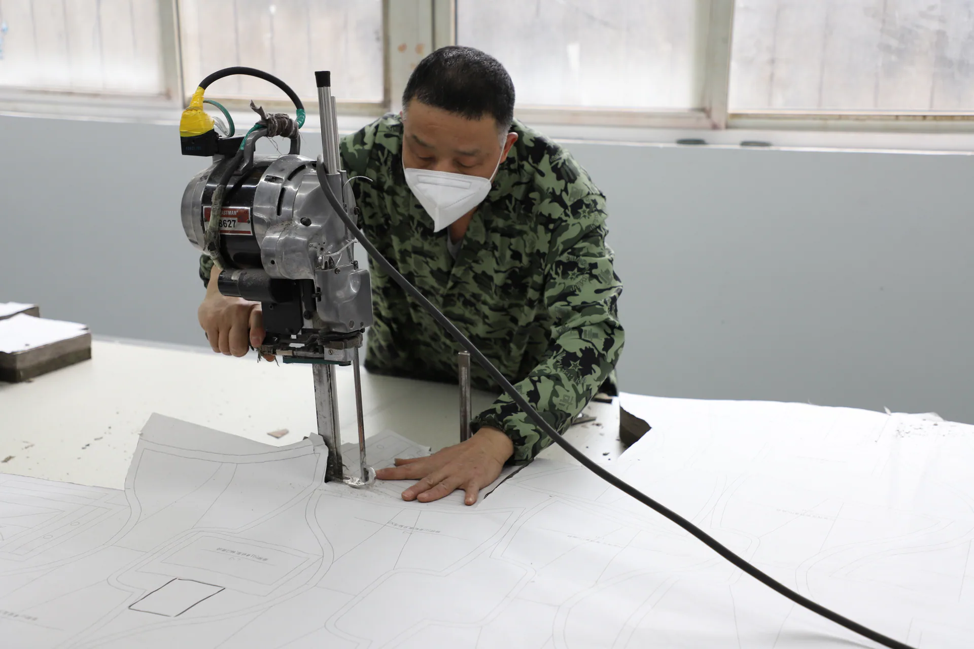 Garment fabric cutting work at Wuhan Jinteng